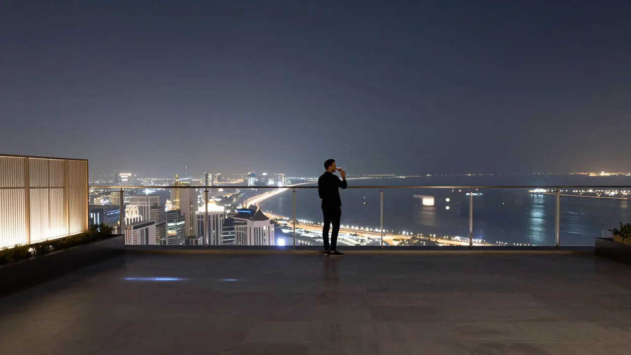 Rooftop bar at midnight with city lights below and solitary figure drinking