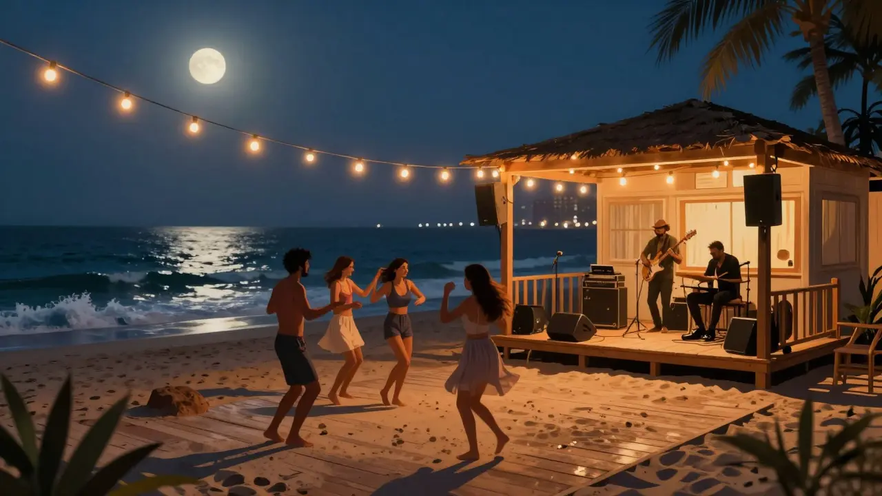 Beachside bar at night with people dancing barefoot under string lights and ocean waves.