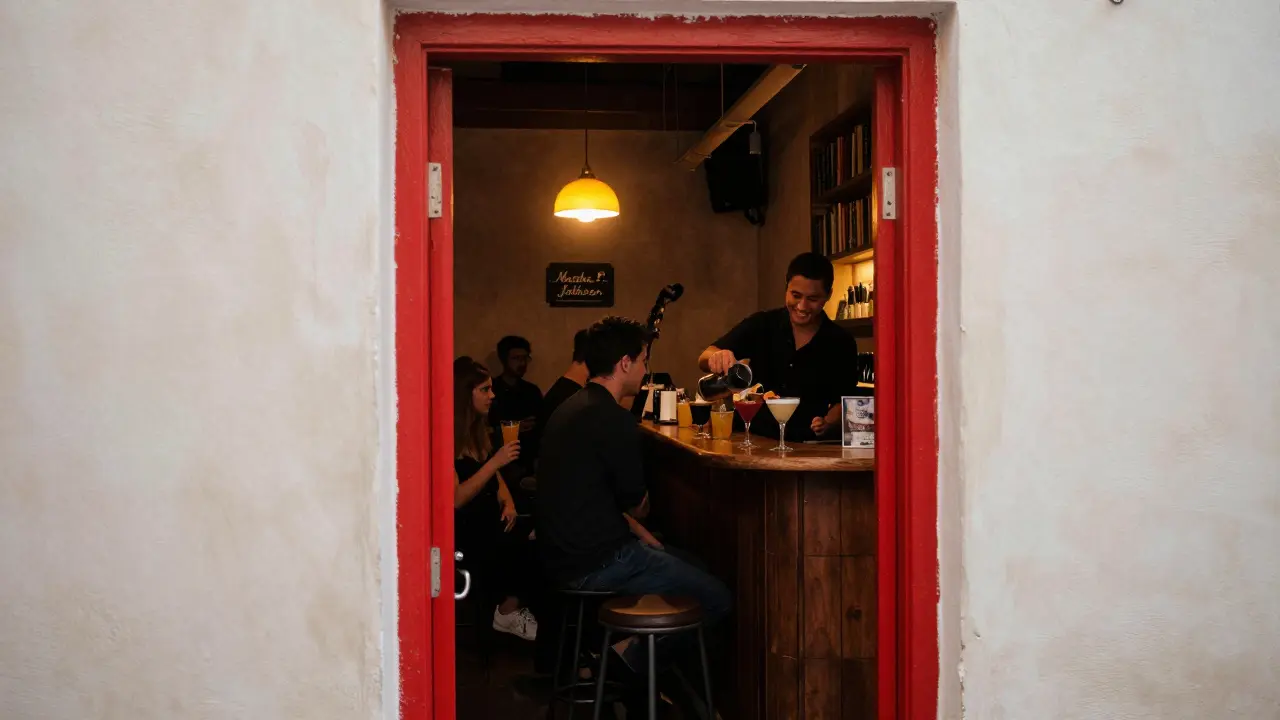 A hidden red door opens to a cozy jazz lounge with books and craft cocktails in Dubai's Al Quoz district.