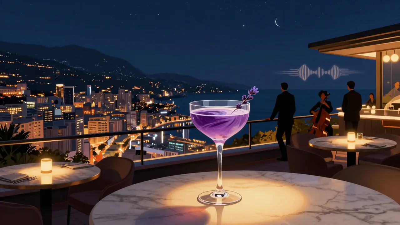 Rooftop lounge at Le Palace with city and sea view, cocktail in glass.